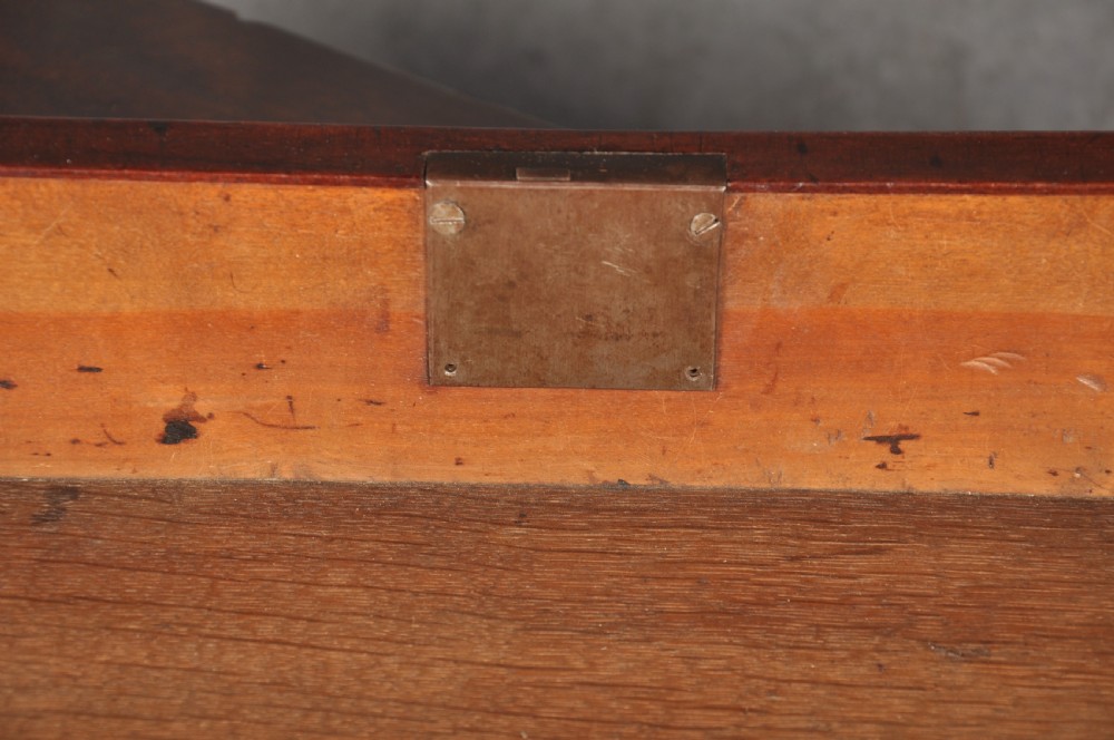 An 18th-century Georgian mahogany kneehole desk featuring brass swan-neck handles, a central recessed cupboard, and bracket feet. View XIII