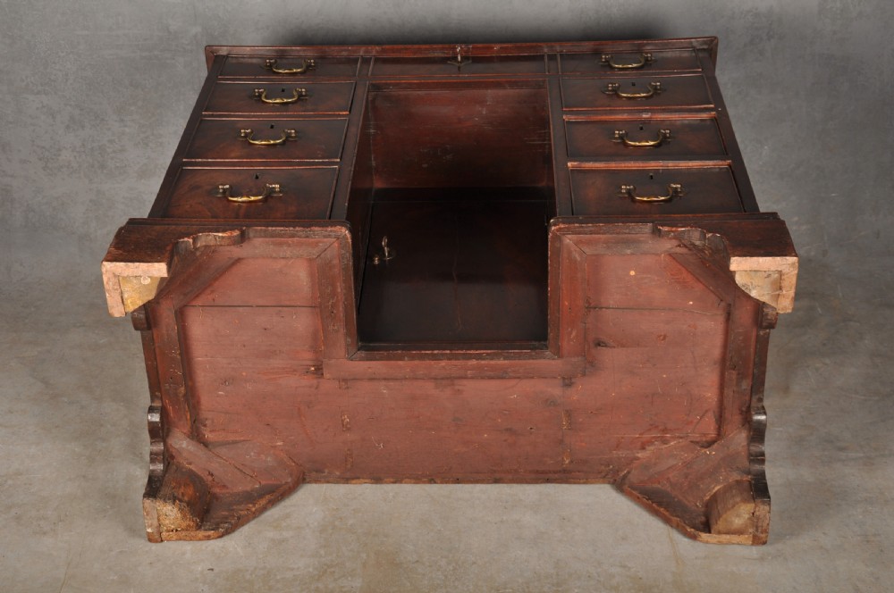 An 18th-century Georgian mahogany kneehole desk featuring brass swan-neck handles, a central recessed cupboard, and bracket feet. View XIV