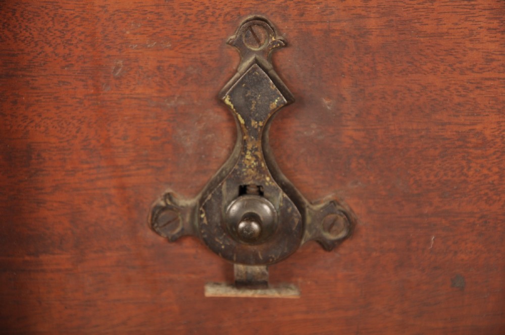 An 18th-century mahogany tripod table with a circular top supported by a turned central stem and three splayed cabriole legs with pad feet. View VII