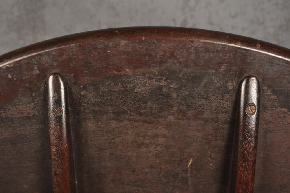 An 18th-century mahogany tripod table featuring a circular top, a central turned baluster pedestal, and three cabriole legs terminating in pad feet. View IX