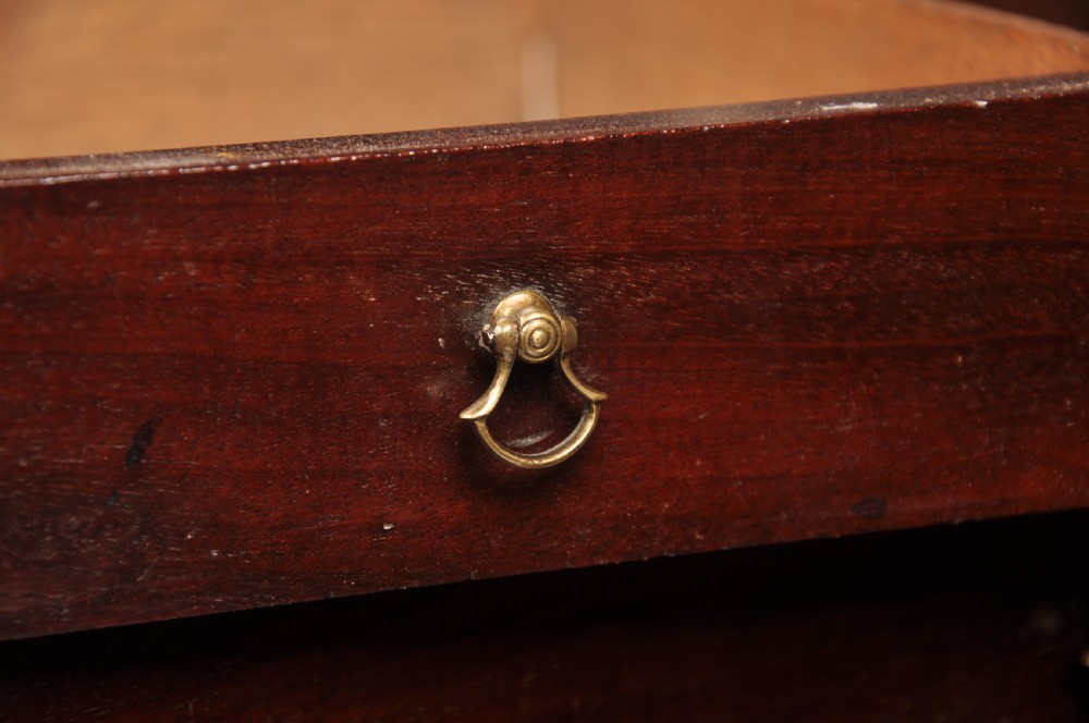An eighteenth-century mahogany slant-front writing bureau featuring four graduated drawers with brass swan-neck handles and bracket feet. View IX