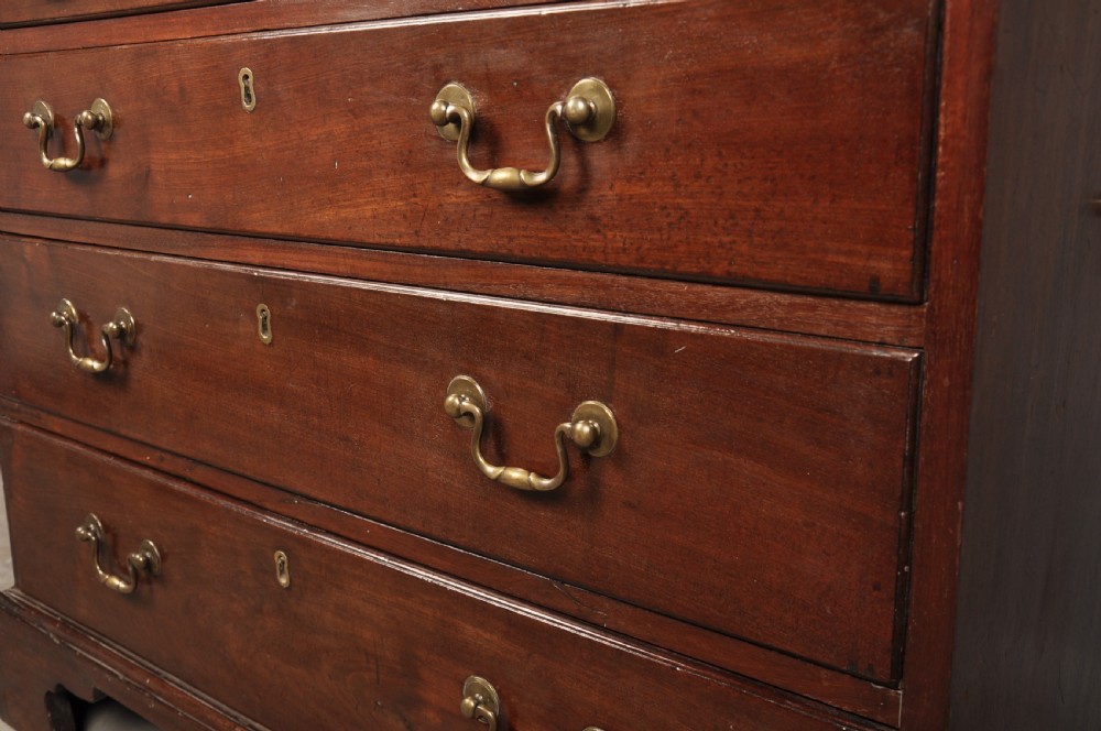 An eighteenth-century mahogany slant-front writing bureau featuring four graduated drawers with brass swan-neck handles and bracket feet. View XIII