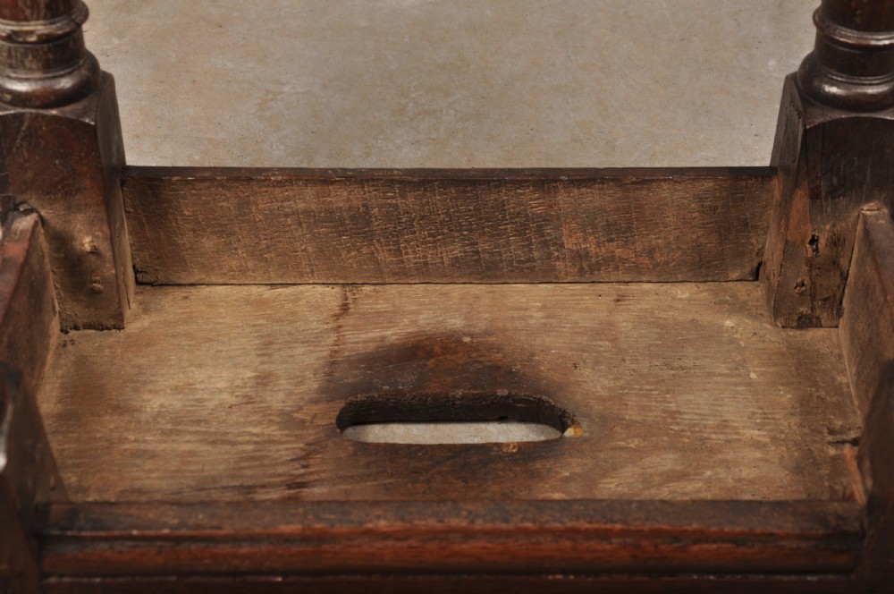 A 17th-century oak joint stool with turned legs, mortise-and-tenon peg construction, and lower perimeter stretchers. View VIII