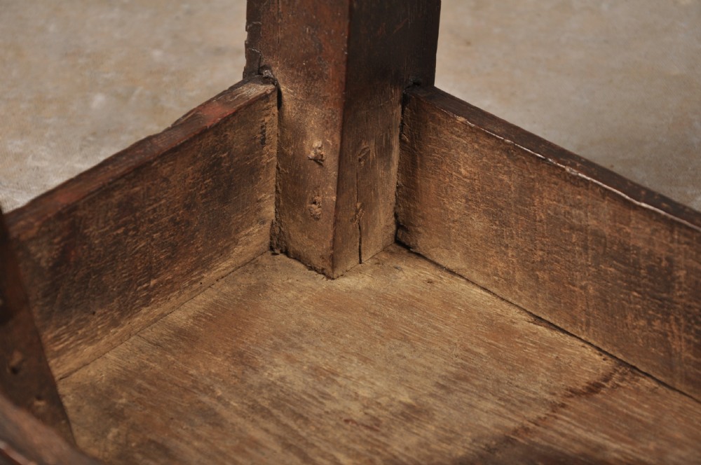 A 17th-century oak joint stool with turned legs, mortise-and-tenon peg construction, and lower perimeter stretchers. View IX