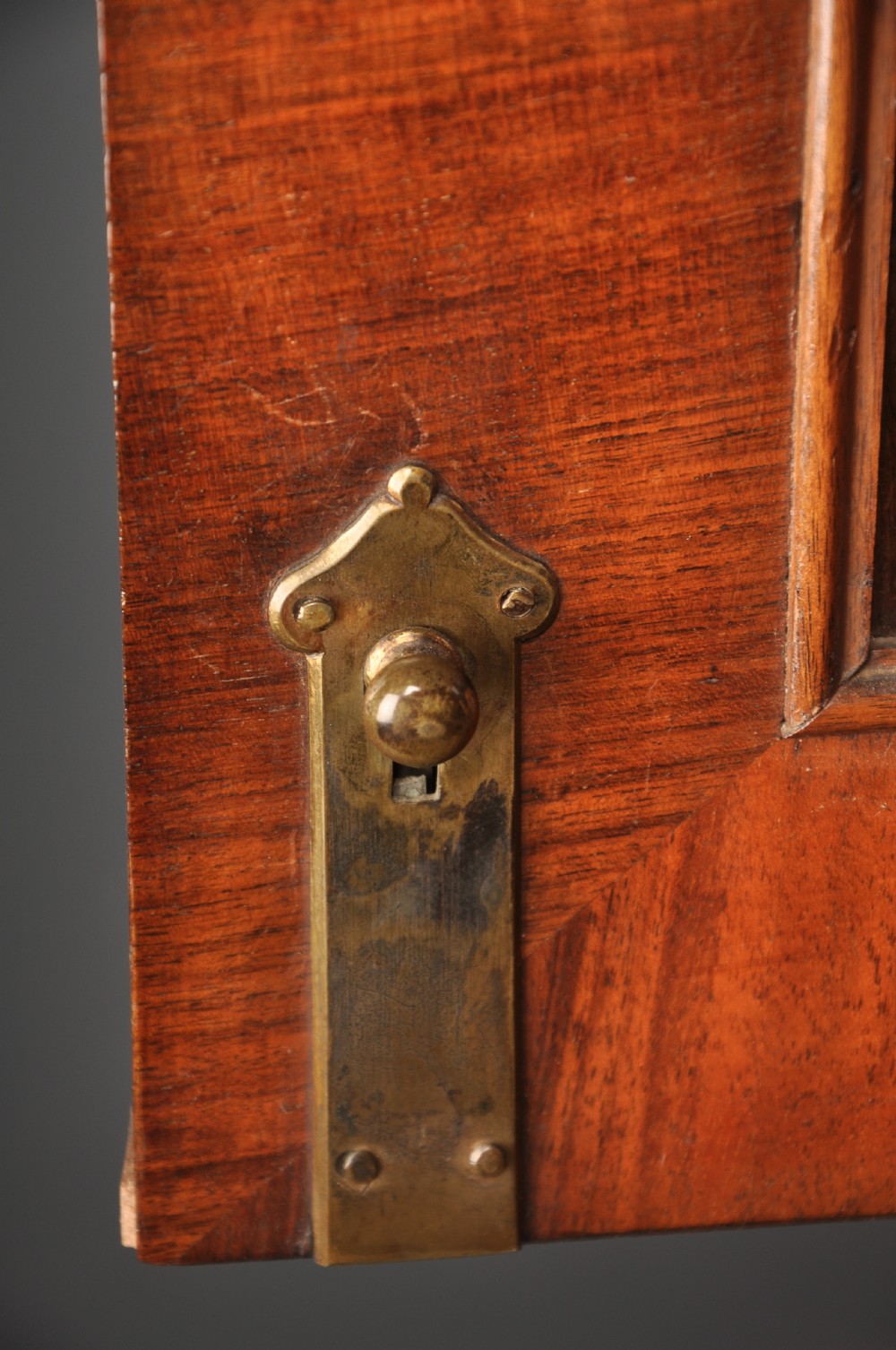 An early eighteenth-century burr walnut secretaire cabinet featuring double upper doors and a lower chest of drawers with brass handles. View VIII