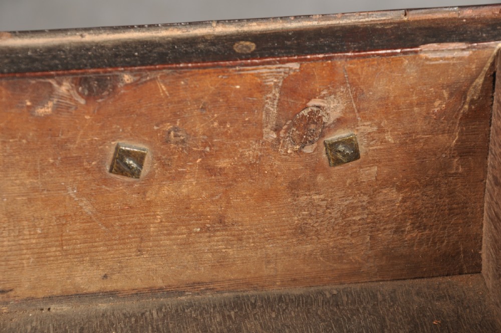 An 18th-century George II mahogany lowboy with three drawers, brass handles, a central arch apron, and four cabriole legs ending in pad feet. View VII
