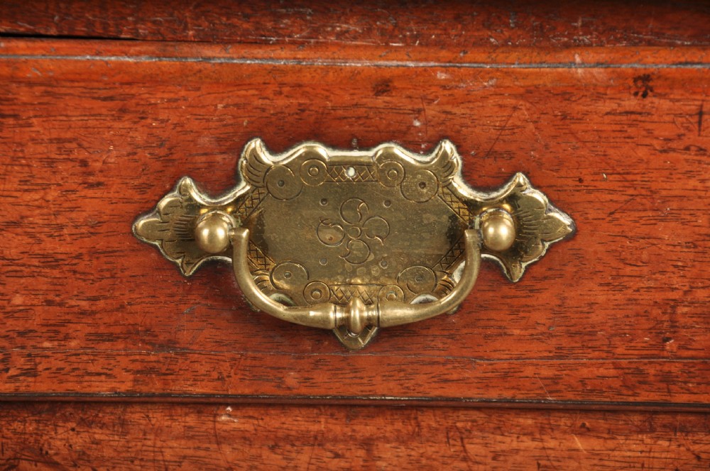 An early 18th-century walnut lowboy side table featuring three drawers with brass handles, a shaped apron, and four cabriole legs. View IV