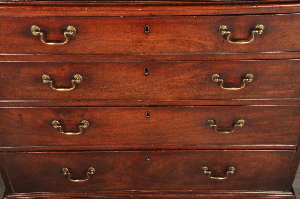 An 18th-century Georgian mahogany chest featuring four graduated drawers with brass swan-neck handles and bracket feet. View III
