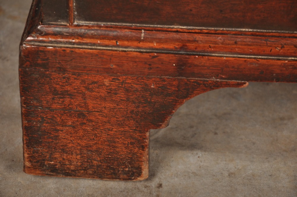 An 18th-century Georgian mahogany chest featuring four graduated drawers with brass swan-neck handles and bracket feet. View X