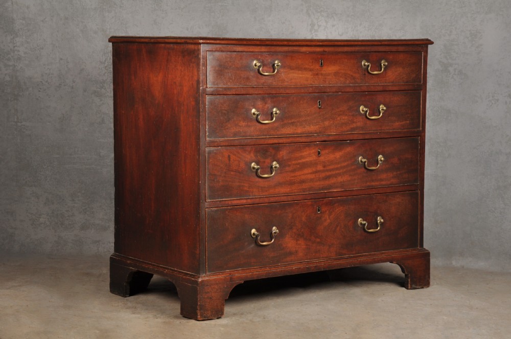 An 18th-century Georgian mahogany chest featuring four graduated drawers with brass swan-neck handles and bracket feet. View XII