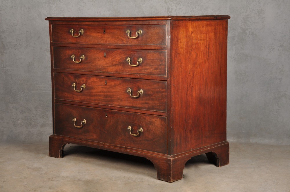 An 18th-century Georgian mahogany chest featuring four graduated drawers with brass swan-neck handles and bracket feet. View XIII