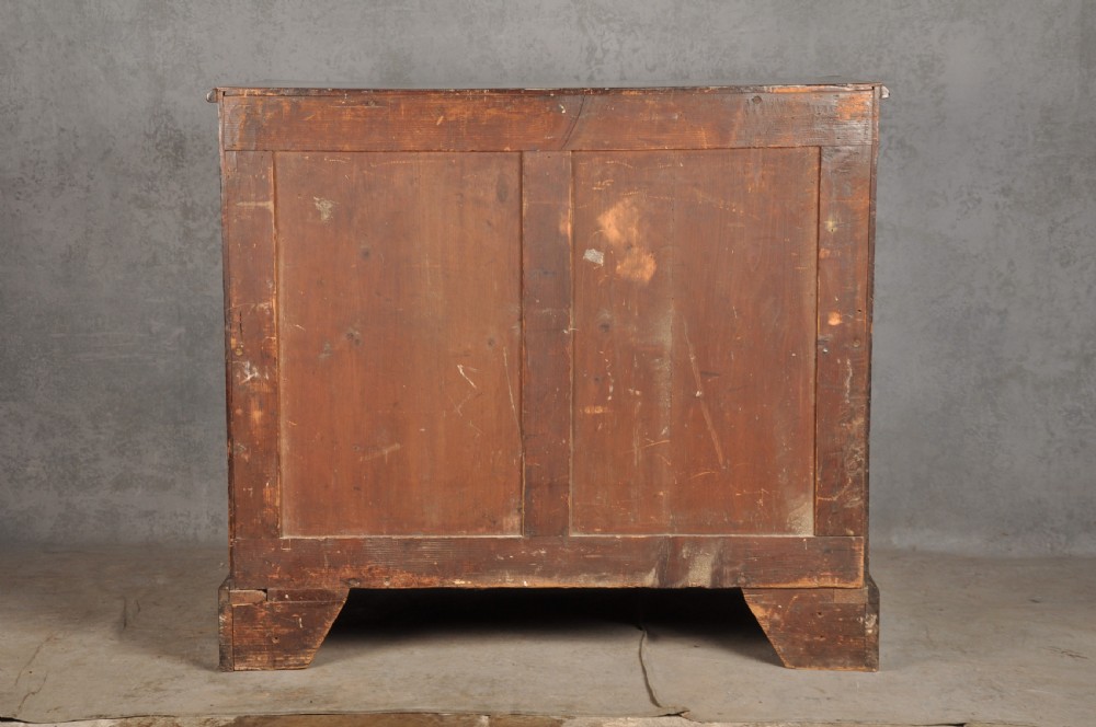 An 18th-century Georgian mahogany chest featuring four graduated drawers with brass swan-neck handles and bracket feet. View XV