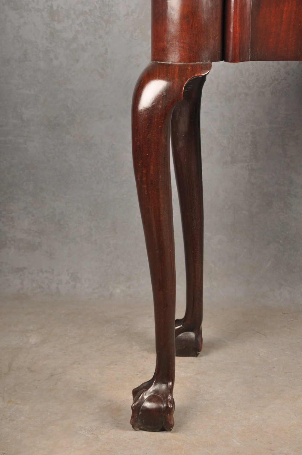 An 18th-century Georgian mahogany fold-over tea table featuring cabriole legs terminating in hand-carved ball and claw feet. View IX