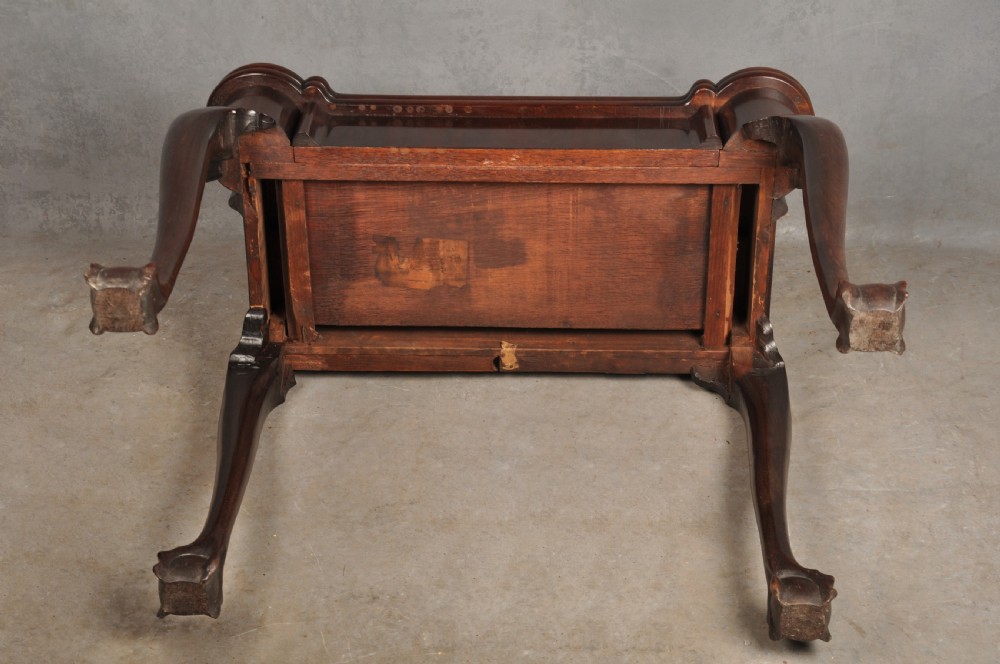 An 18th-century Georgian mahogany fold-over tea table featuring cabriole legs terminating in hand-carved ball and claw feet. View XVII