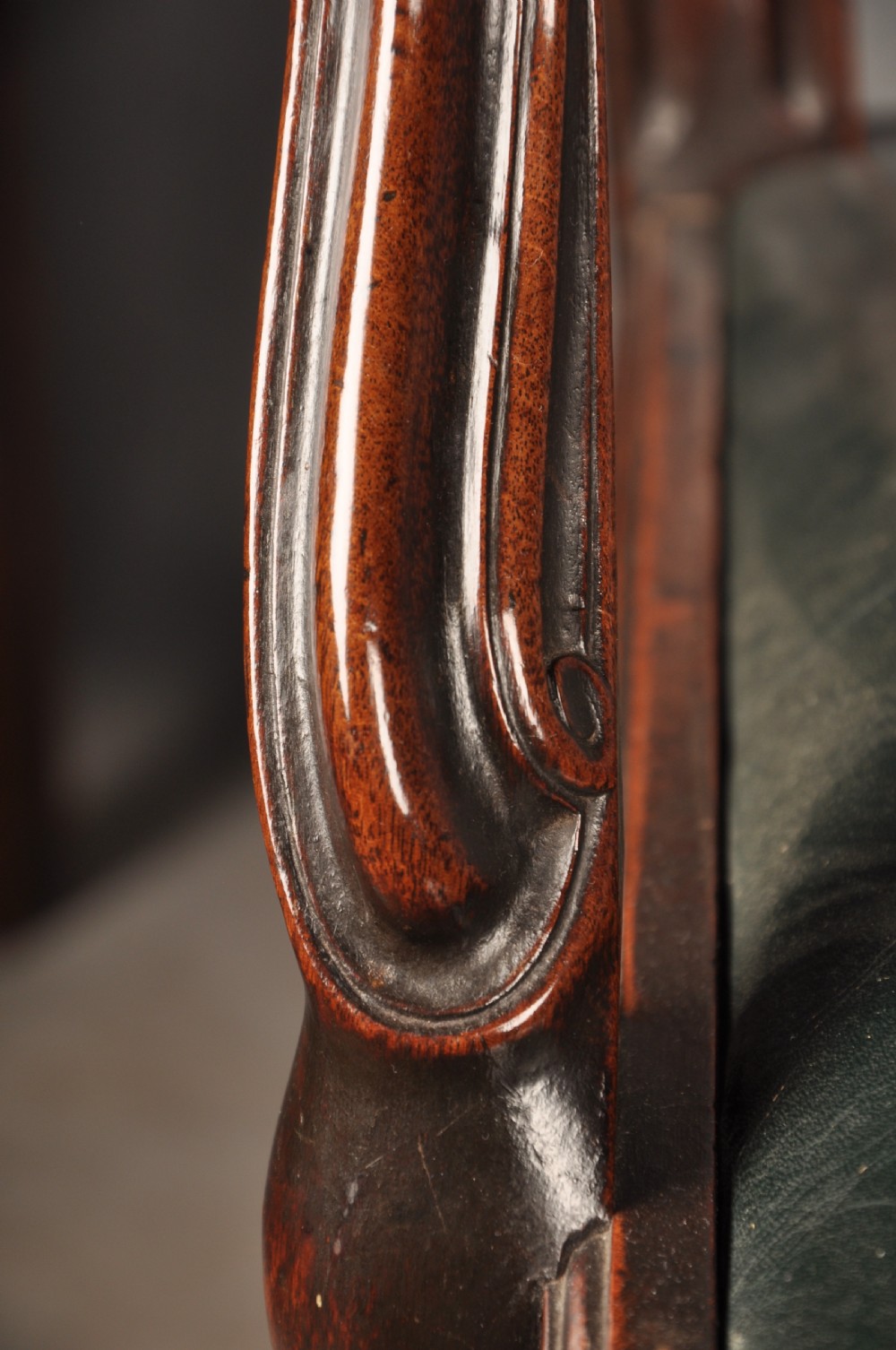 A set of eight 18th-century mahogany Hepplewhite dining chairs featuring pierced splat backrests, serpentine crest rails, square legs with stretchers, and dark green leather drop-in seats. View VIII