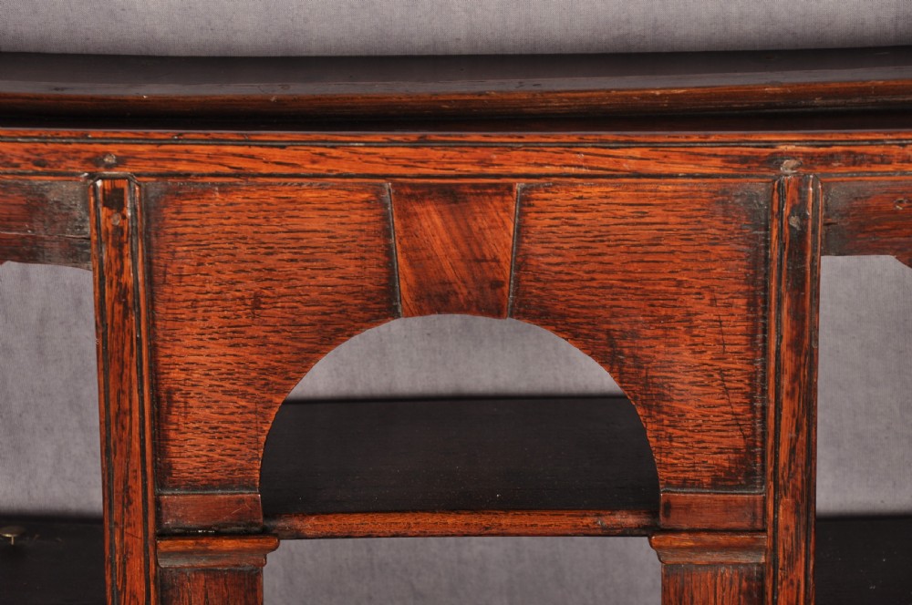 An eighteenth-century dark oak delft rack featuring open shelves, a central arched niche, and a moulded top cornice. View III
