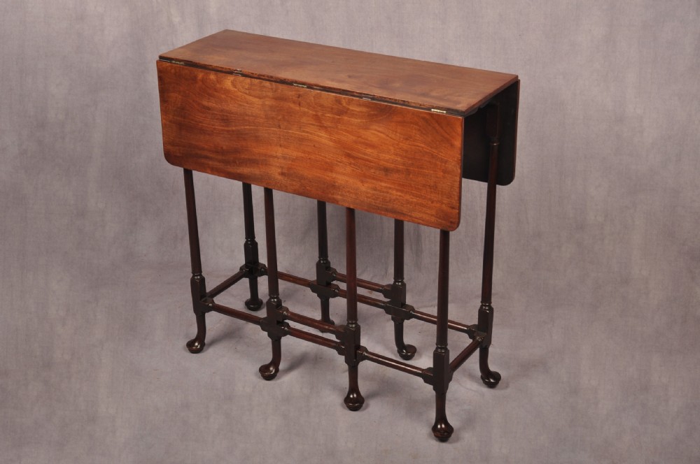 An eighteenth-century mahogany drop-leaf spider table featuring slender turned legs, cross stretchers, and pad feet. View III