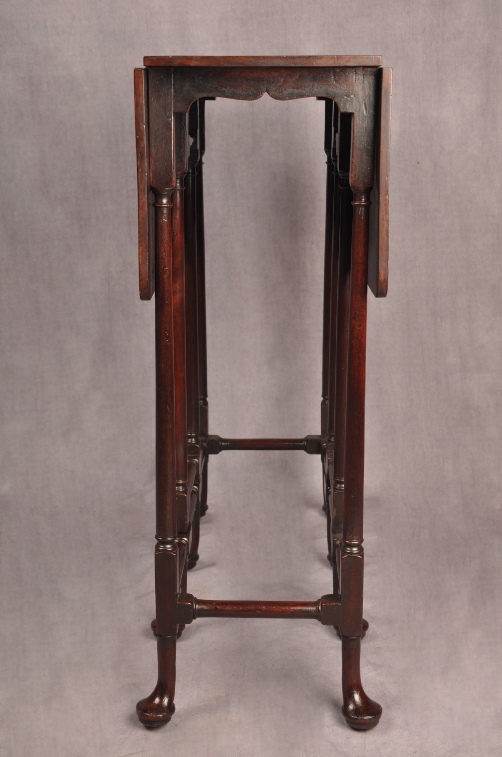 An eighteenth-century mahogany drop-leaf spider table featuring slender turned legs, cross stretchers, and pad feet. View VI