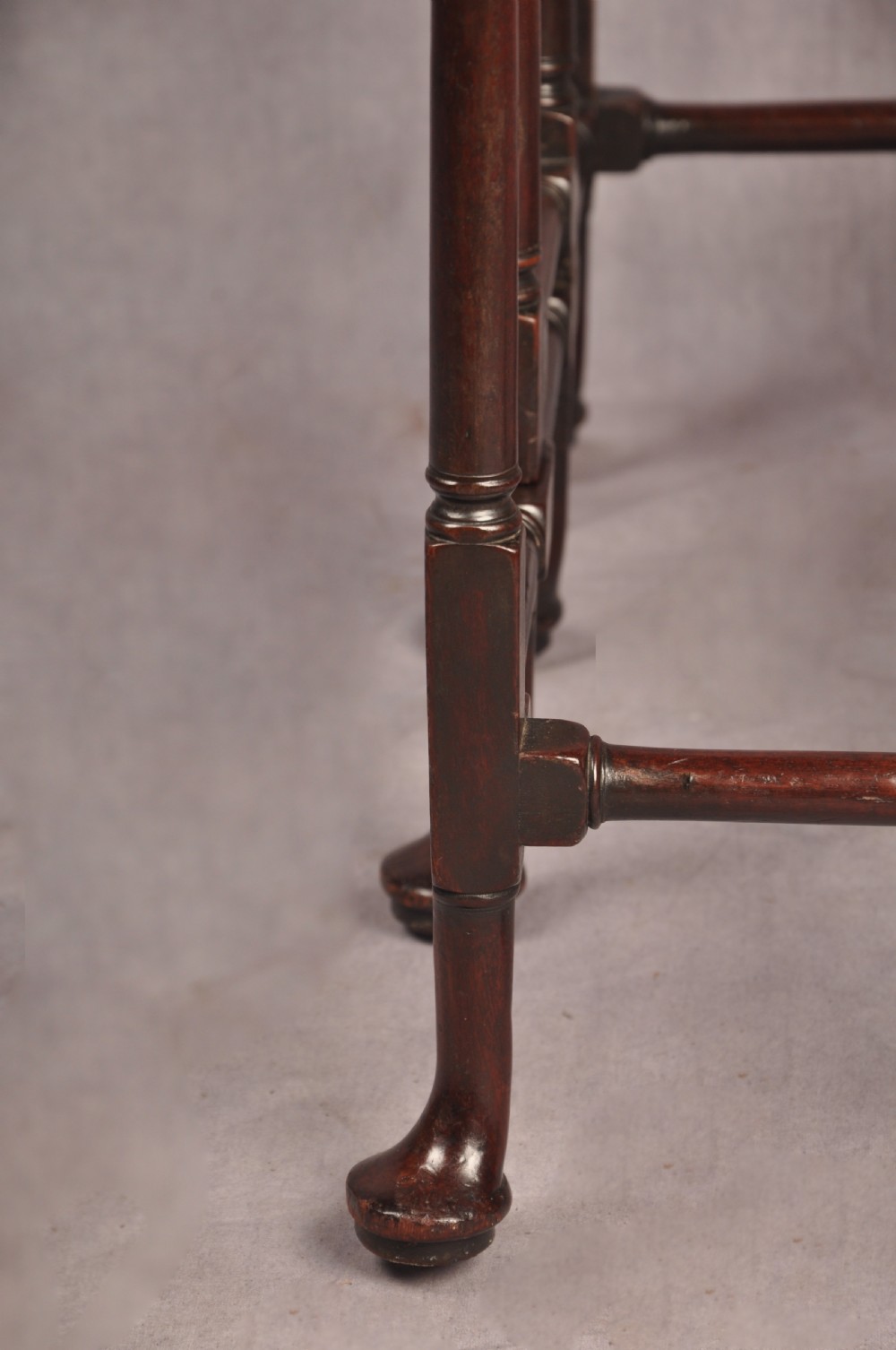 An eighteenth-century mahogany drop-leaf spider table featuring slender turned legs, cross stretchers, and pad feet. View VII