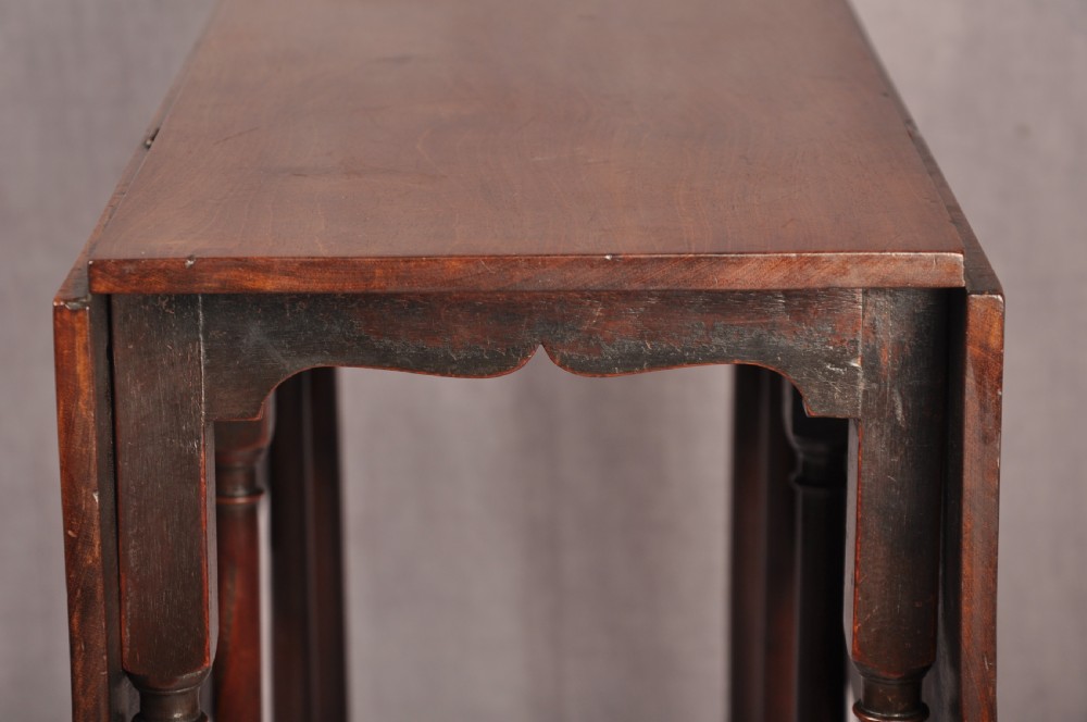 An eighteenth-century mahogany drop-leaf spider table featuring slender turned legs, cross stretchers, and pad feet. View IX