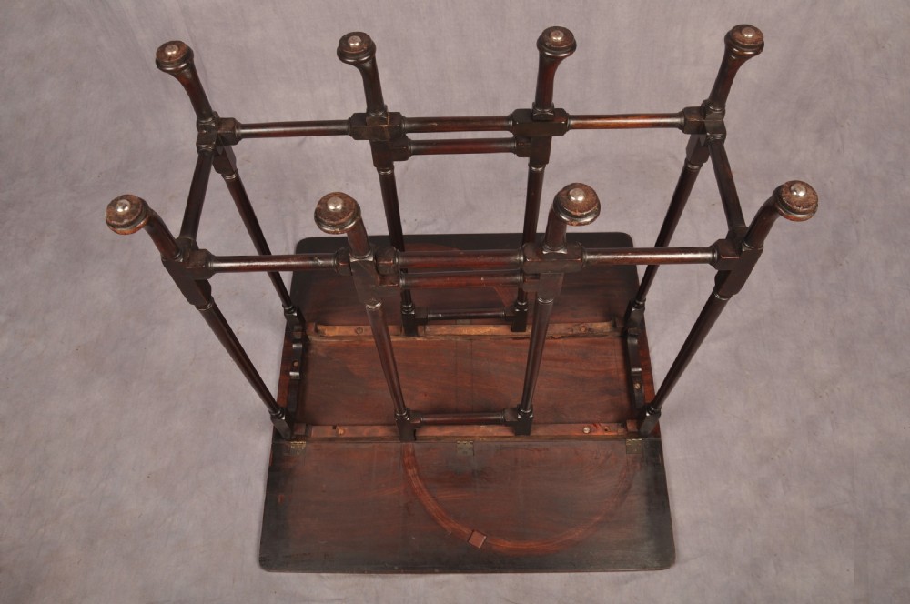 An eighteenth-century mahogany drop-leaf spider table featuring slender turned legs, cross stretchers, and pad feet. View XIII