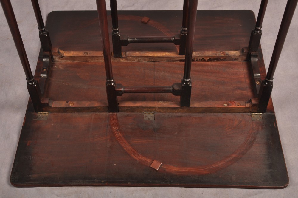 An eighteenth-century mahogany drop-leaf spider table featuring slender turned legs, cross stretchers, and pad feet. View XIV