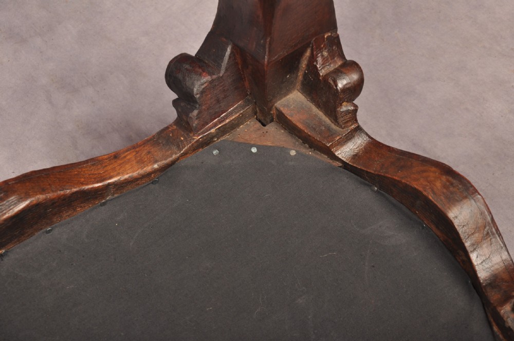 A 19th-century carved walnut stool featuring cabriole legs with claw-and-ball feet and a peach patterned upholstered top. View XI
