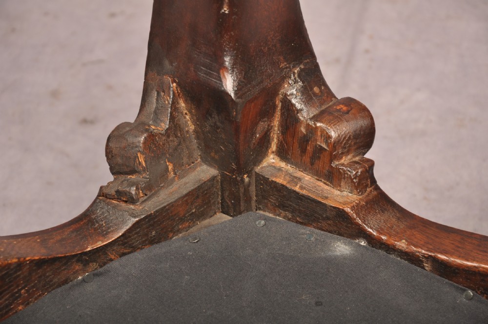 A 19th-century carved walnut stool featuring cabriole legs with claw-and-ball feet and a peach patterned upholstered top. View XII