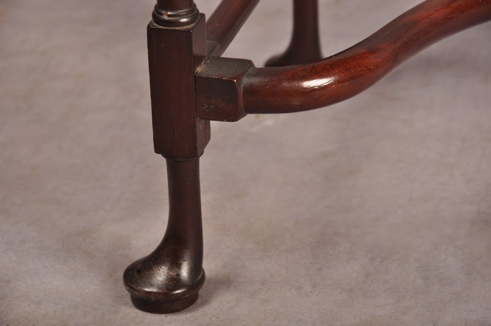 An 18th-century dark mahogany spider leg table featuring slender turned legs, curved stretchers, pad feet, and a drop-leaf top. View VIII