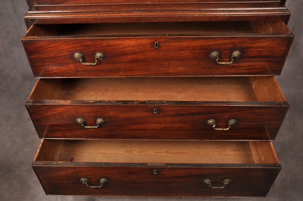 An 18th-century Georgian mahogany tallboy chest-on-chest featuring two short drawers over five long drawers with brass handles and bracket feet. View III