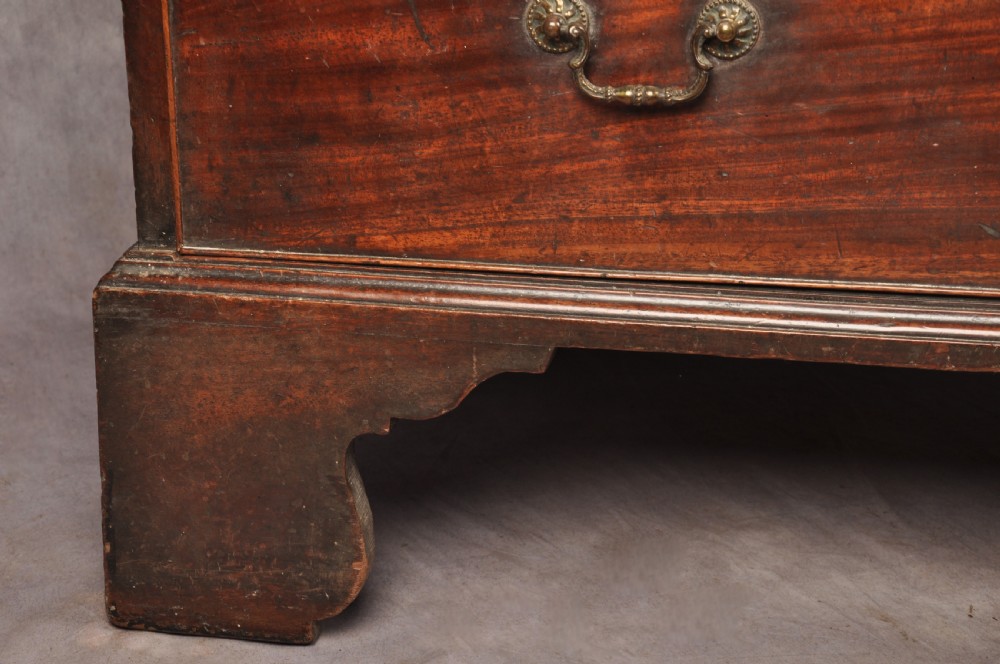 An 18th-century Georgian mahogany tallboy chest-on-chest featuring two short drawers over five long drawers with brass handles and bracket feet. View V