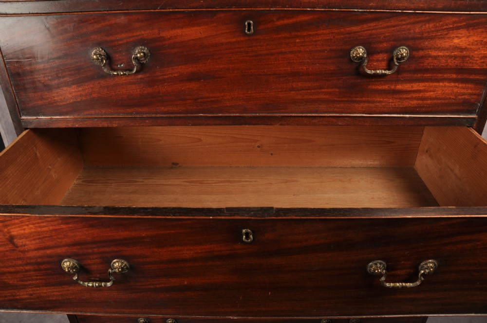 An 18th-century Georgian mahogany tallboy chest-on-chest featuring two short drawers over five long drawers with brass handles and bracket feet. View VI