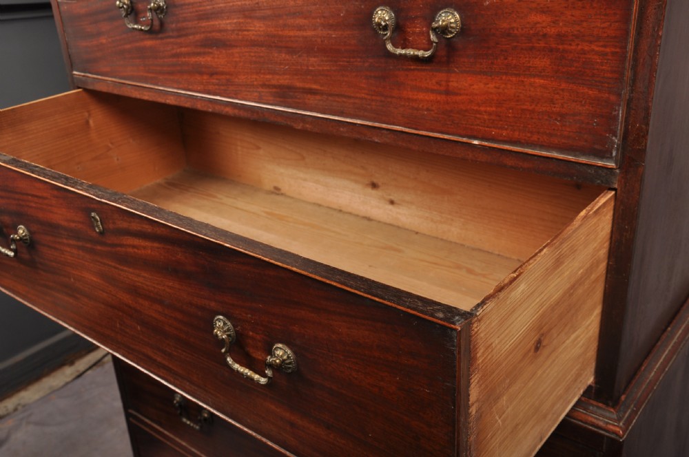 An 18th-century Georgian mahogany tallboy chest-on-chest featuring two short drawers over five long drawers with brass handles and bracket feet. View VII