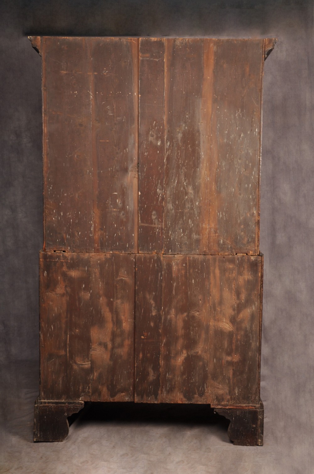 An 18th-century Georgian mahogany tallboy chest-on-chest featuring two short drawers over five long drawers with brass handles and bracket feet. View X