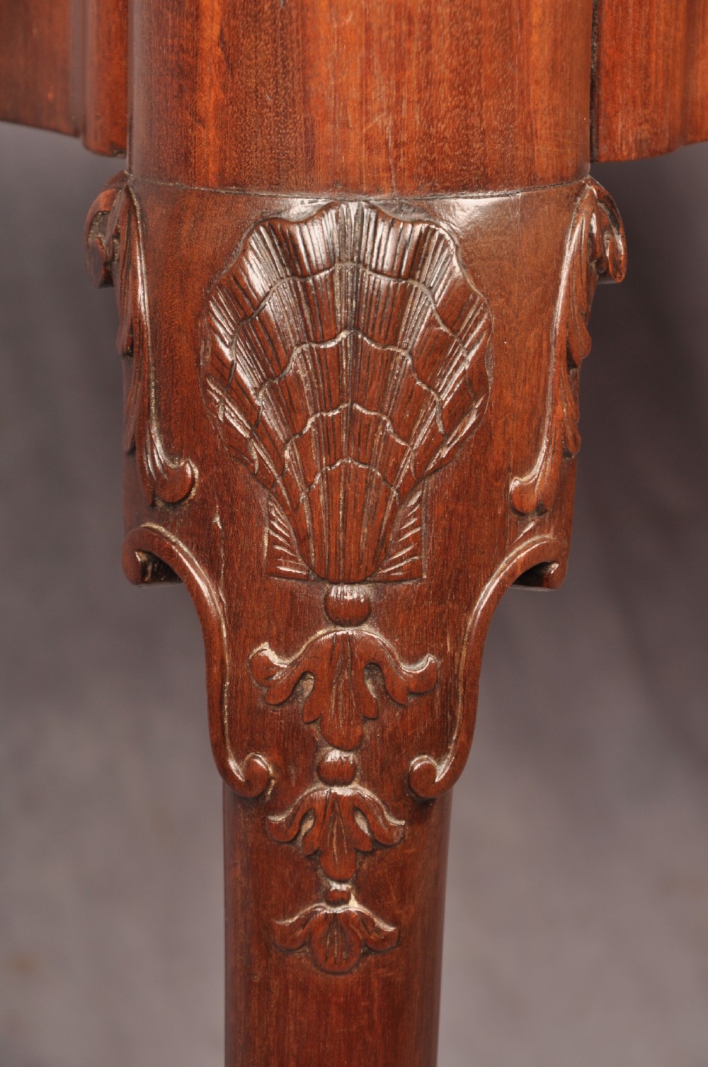 An 18th-century mahogany card table featuring a fold-over top, aproned frame, and carved cabriole legs. View IV