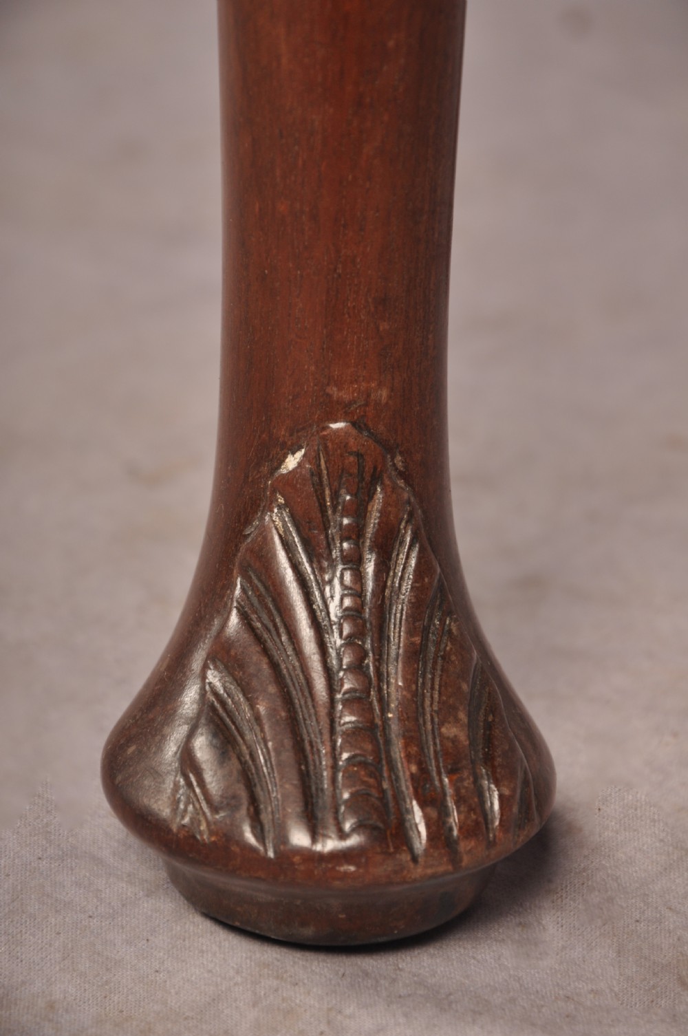 An 18th-century mahogany card table featuring a fold-over top, aproned frame, and carved cabriole legs. View V