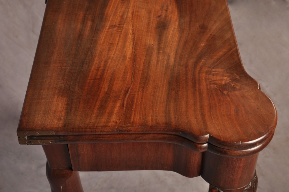 An 18th-century mahogany card table featuring a fold-over top, aproned frame, and carved cabriole legs. View VI