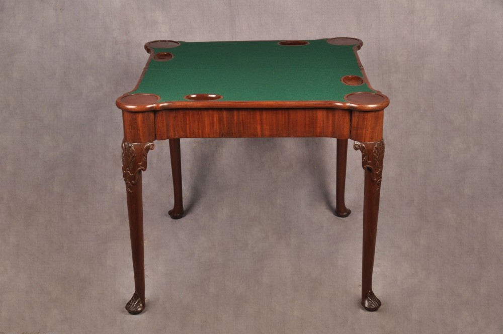 An 18th-century mahogany card table featuring a fold-over top, aproned frame, and carved cabriole legs. View VII