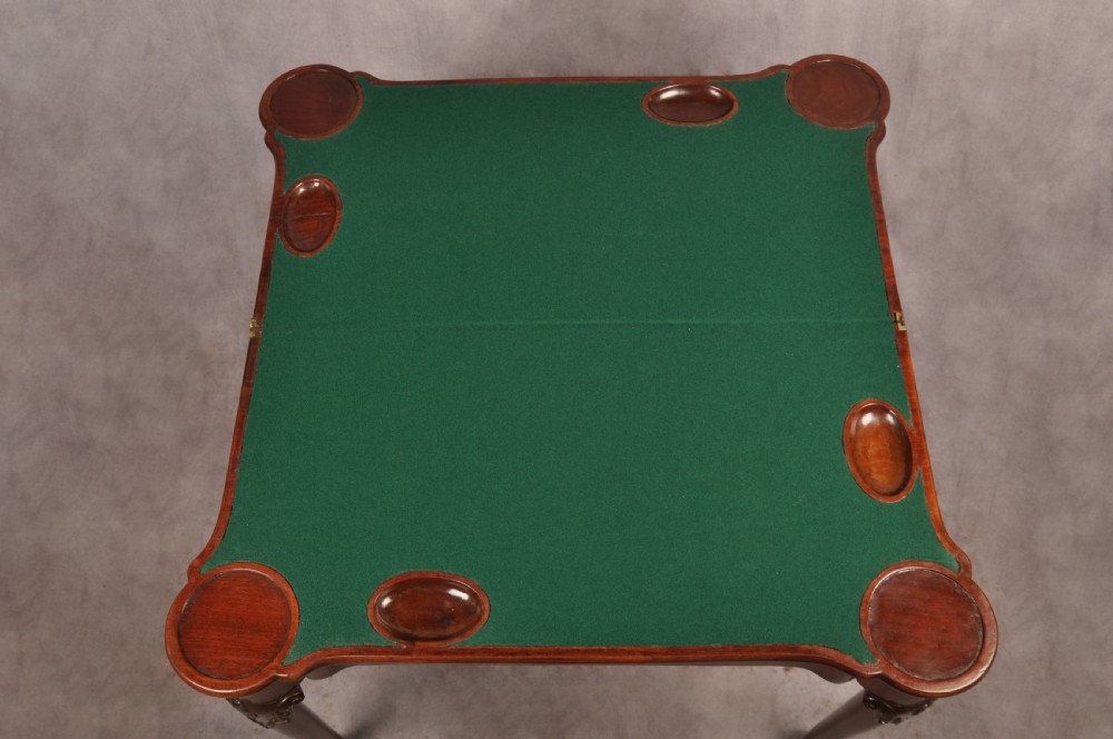 An 18th-century mahogany card table featuring a fold-over top, aproned frame, and carved cabriole legs. View VIII