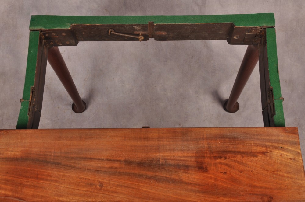 An 18th-century mahogany card table featuring a fold-over top, aproned frame, and carved cabriole legs. View IX