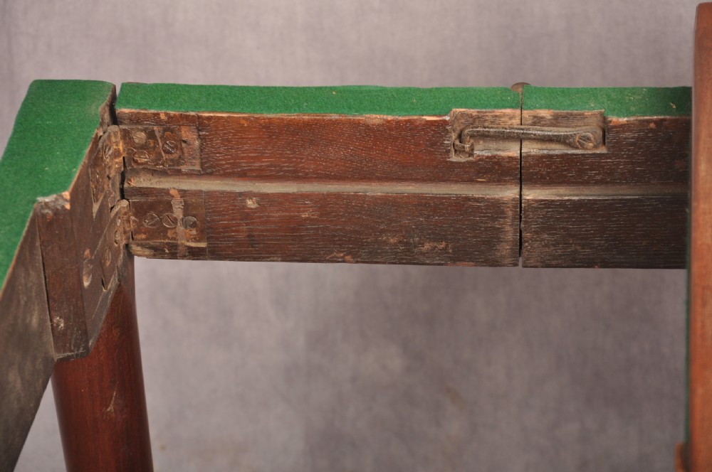 An 18th-century mahogany card table featuring a fold-over top, aproned frame, and carved cabriole legs. View X
