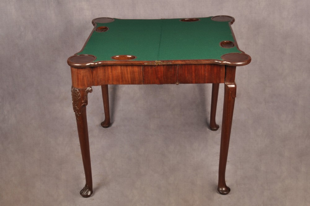 An 18th-century mahogany card table featuring a fold-over top, aproned frame, and carved cabriole legs. View XI