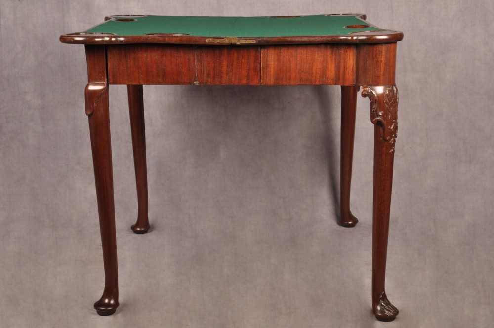 An 18th-century mahogany card table featuring a fold-over top, aproned frame, and carved cabriole legs. View XII