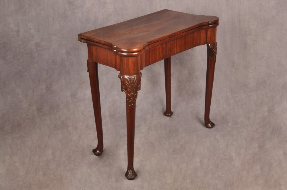 An 18th-century mahogany card table featuring a fold-over top, aproned frame, and carved cabriole legs. View XIII