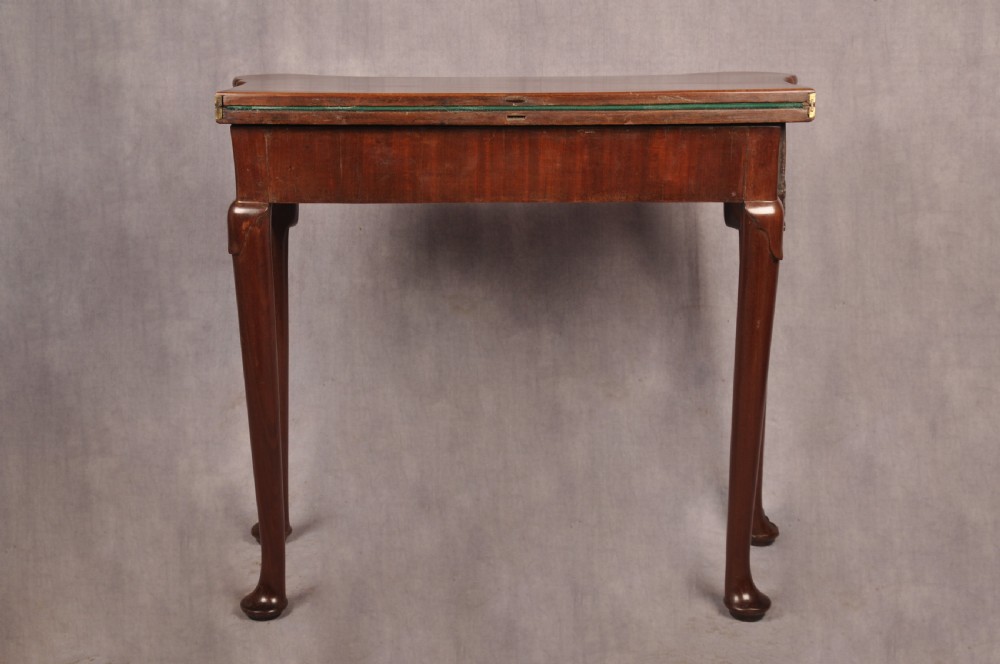 An 18th-century mahogany card table featuring a fold-over top, aproned frame, and carved cabriole legs. View XV