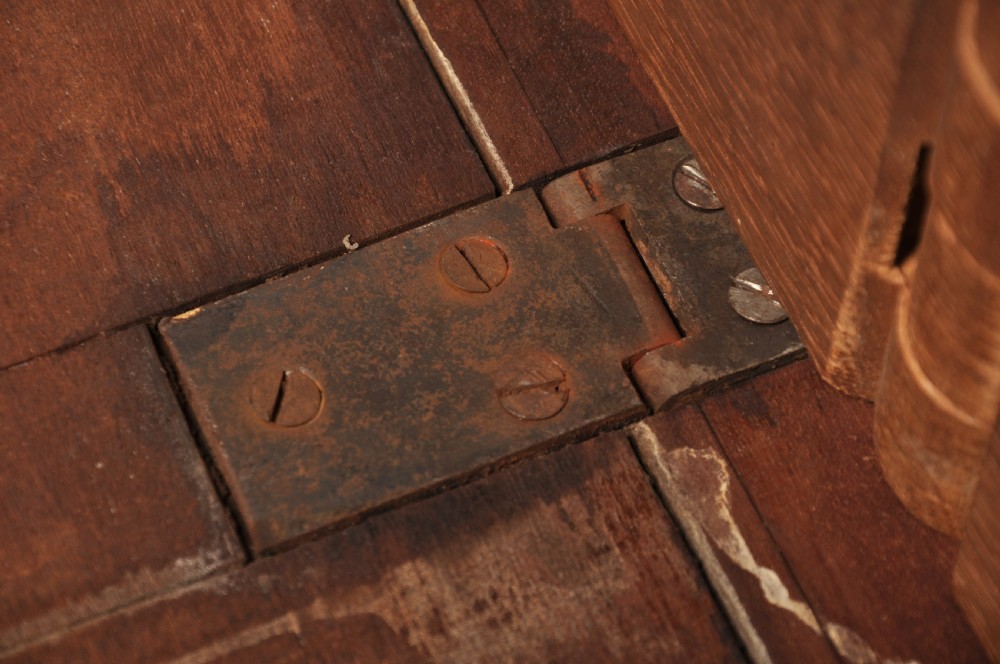 An 18th-century mahogany drop-leaf gateleg table with tapered legs, pad feet, and a scalloped apron on a plain background. View XI