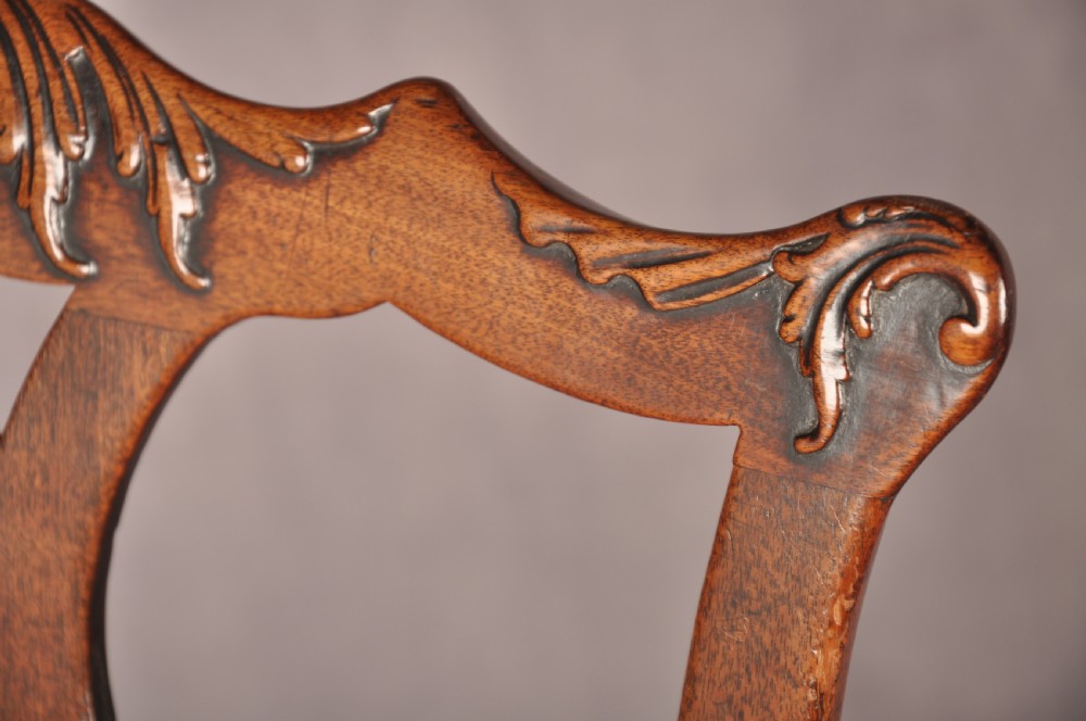 A pair of 18th-century mahogany Chippendale side chairs featuring carved pierced back splats and light patterned upholstered seat pads. View III