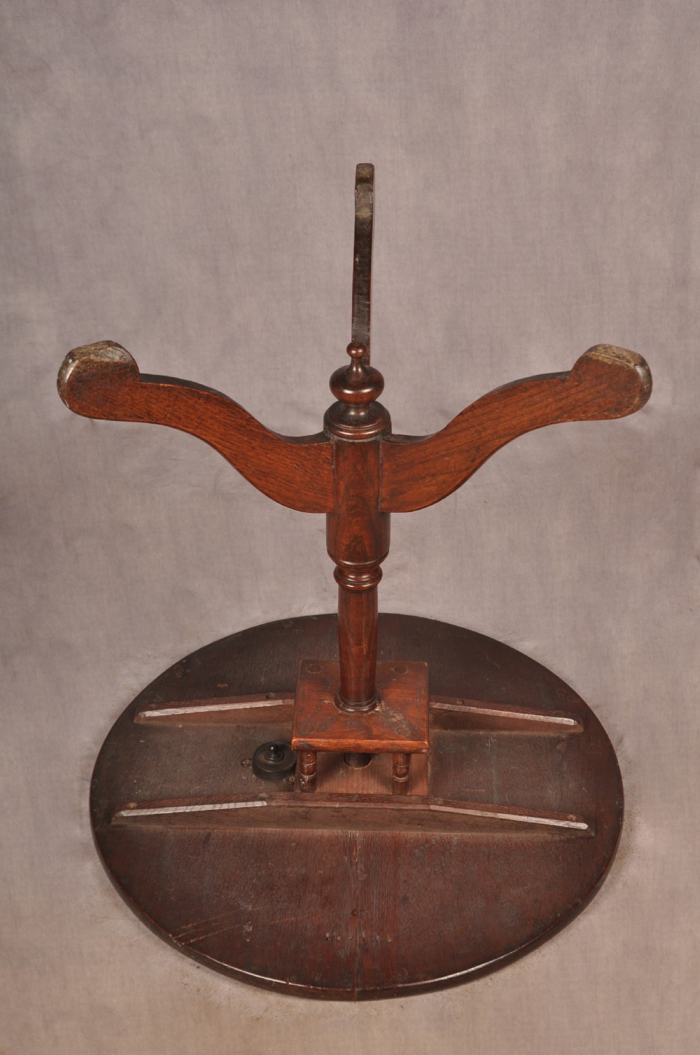An 18th-century dark oak tripod table featuring a circular top, turned spindle birdcage stem, and three splayed cabriole legs. View VIII