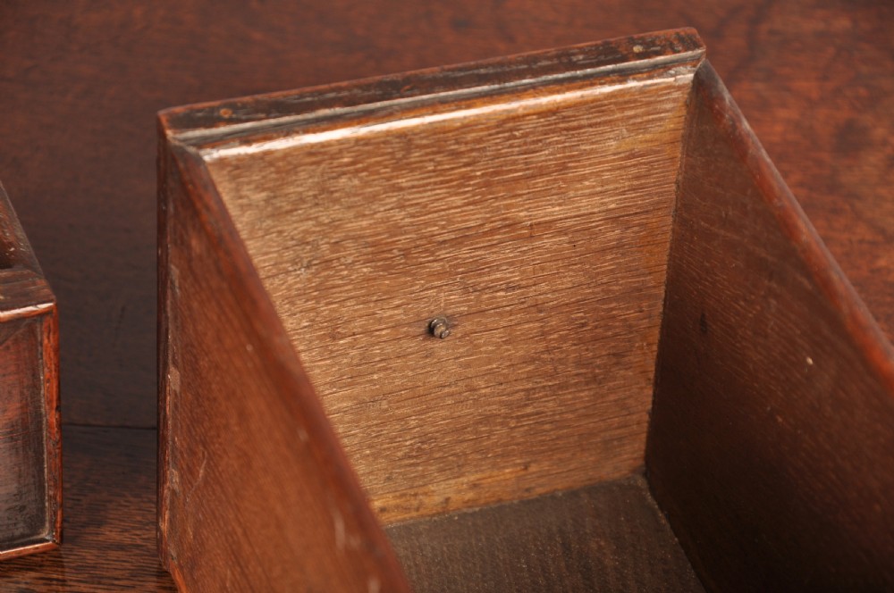 An early 18th-century dark oak lowboy side table featuring three drawers with brass drop handles, a shaped apron, and four cabriole legs. View XIII