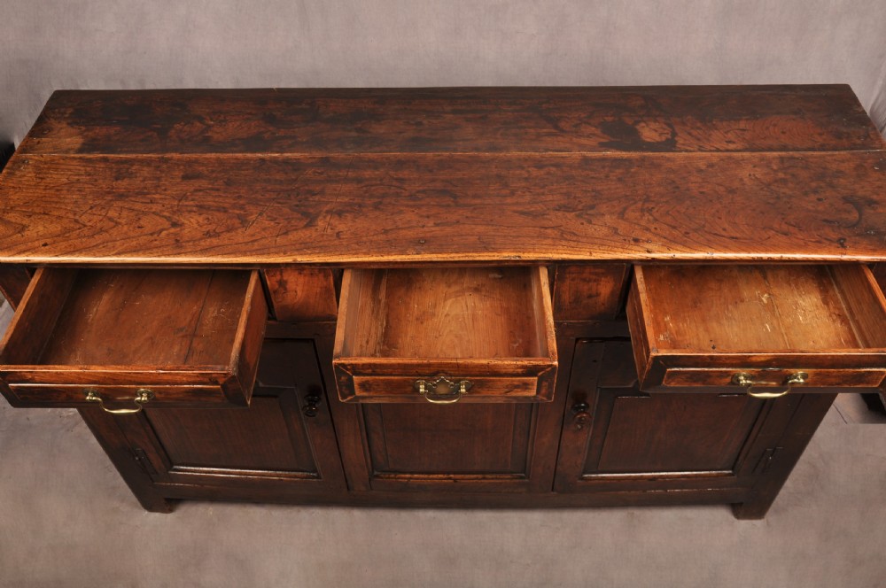 A rare mid 18th Century Welsh Elm Dresser Base View VIII